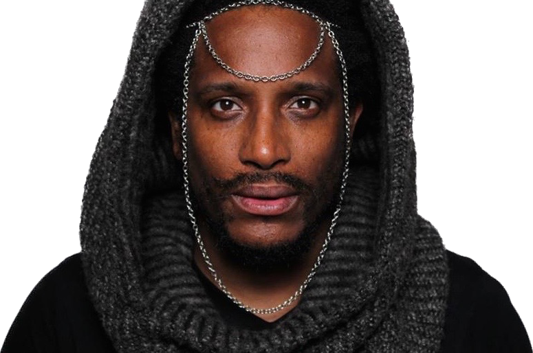 Shon Abram wearing a dark knitted hood with a silver chain headpiece
